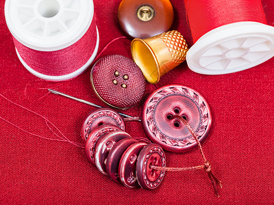 红卷轴素材缝线纽扣针头红织物背景