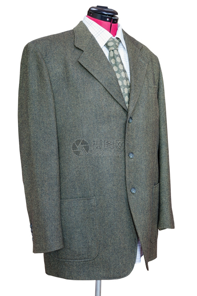 裁缝造型模特装的西穿着衬衫和领带的绿色长毛外套白背景上孤立的衬衫和领带图片