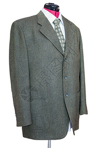 裁缝造型模特装的西穿着衬衫和领带的绿色长毛外套白背景上孤立的衬衫和领带背景图片