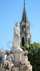 尼姆纪念碑前往法国普罗旺斯Pradier喷泉的雕像和尼米斯市圣佩尔特瓦和尼米姆女塔教堂的景象背景