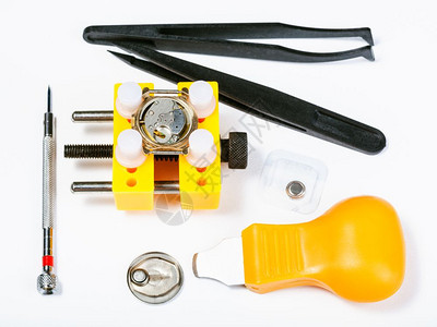 watchmaker车间白色背景监视替换电池的工具集顶部视图图片