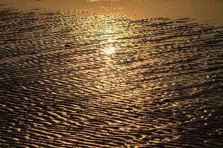 沙滩波温暖纹理图案背景日出阴影图片