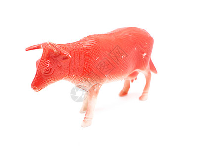 陶瓷动物白色背景的红公牛玩具背景