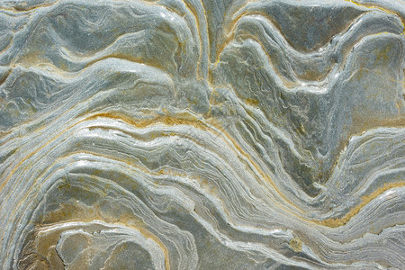 纹理潮湿的海石有波浪污点图片