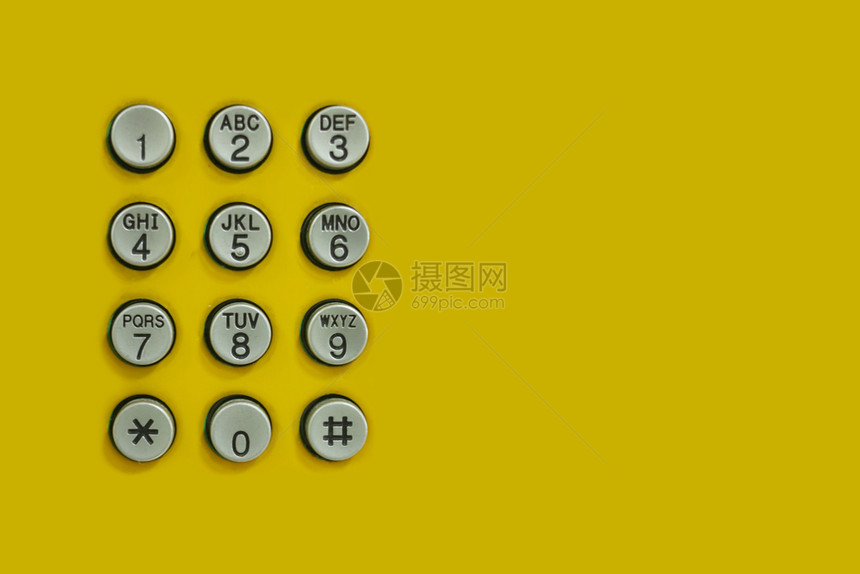 设计技术背景的黄色上电话数字键盘图片