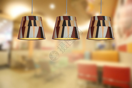 咖啡馆和室内装饰店的现代天花板灯照明温暖背景图片