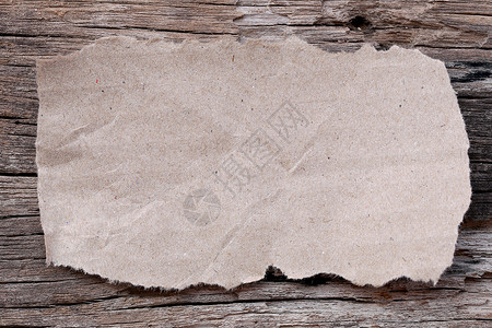 旧木制地板上关于教育或笔记本文字的旧木制纸板上的棕色催泪纸板图片