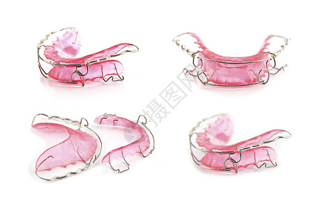 关闭粉红色牙套或用白背景隔绝的用于设计物体粉红色牙套图片