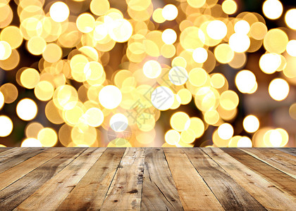 木板桌的空地和圣诞节背景的黑灯设计您工作概念背景图片