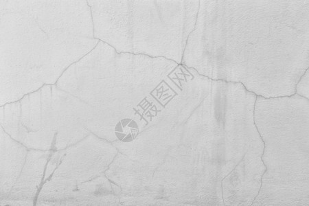 白色水泥墙表面和设计纹理背景的裂缝图片