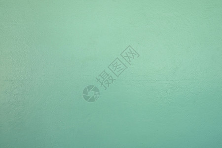在您工作概念背景下设计时的光绿色水泥墙纹理背景表面背景图片
