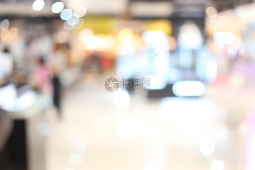 本摘要模糊了内部背景或者在您的工作背景概念中将百货商店的购物中心作为设计的重点图片
