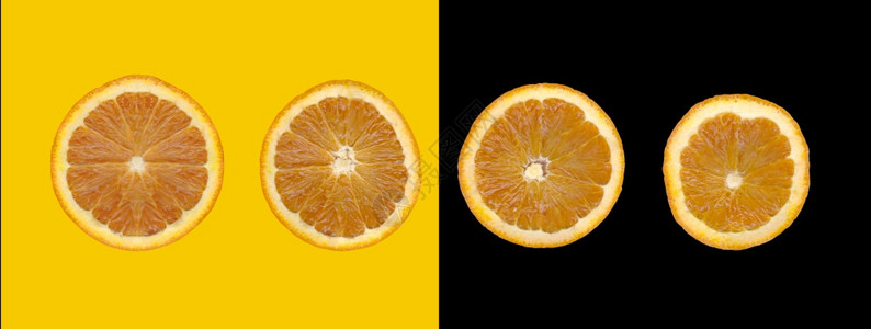 在黄色和黑背景上隔离的橙色切片用于设计你的工作概念图片