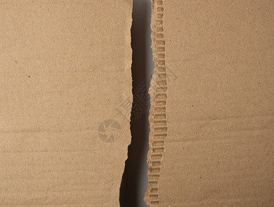 整蛊盒子从盒子下面撕成半棕色纸中间一个空槽整框背景