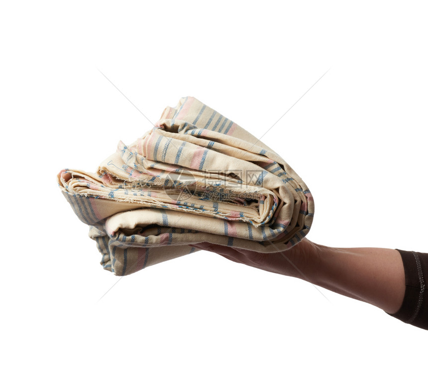 女手握着折叠的棉花织物孤立的白色背景紧闭图片