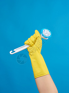 用黄色橡皮手套打扫房屋时图片