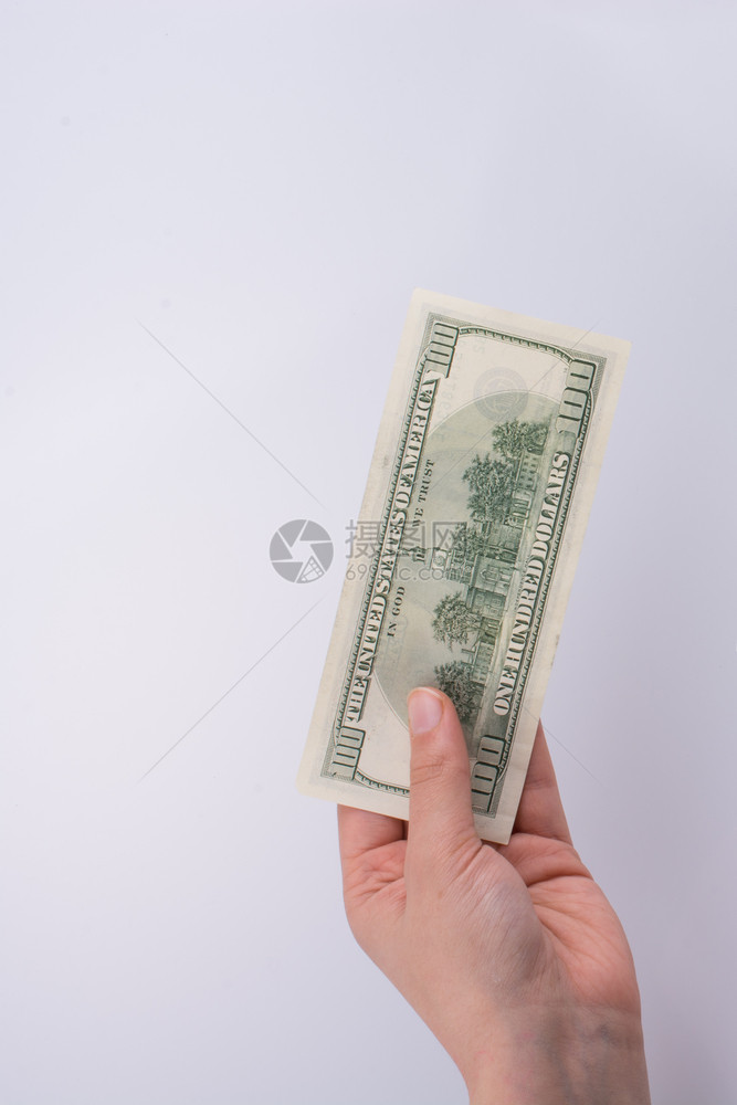 手持美元钞票和TurshLira钞票并肩持有白底钞和TurshLira钞票图片