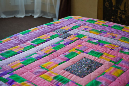 毯子从布料的亮片上被绑在床毯子手工从布料的3029片上缝合图片