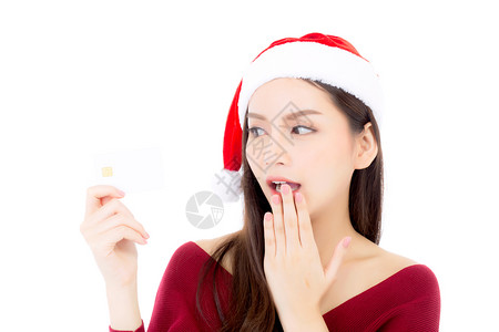 女孩对在白色背景圣诞节和日概念中孤立购物感到愉快图片