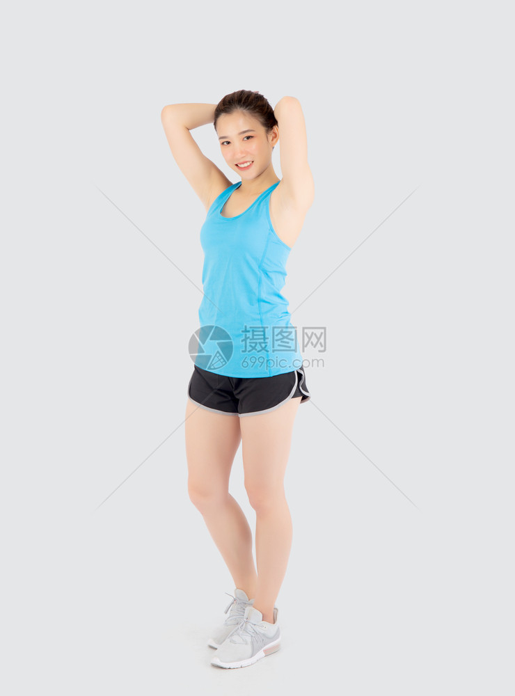 年轻的女站在锻炼的肌肉手臂上身体健康与白人隔绝亚西女孩穿着运动服装和瑜伽图片