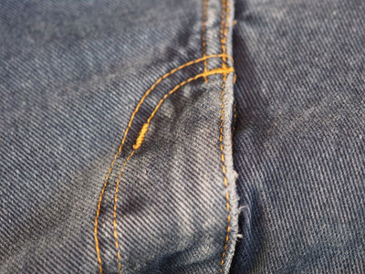 蓝色牛仔裤织物纹理可用作背景蓝色牛仔裤面料纹理背景图片