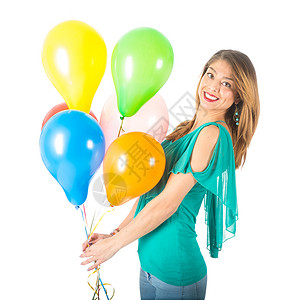 穿着绿色衬衫的漂亮女人拿着白色背景隔离的彩色气球图片