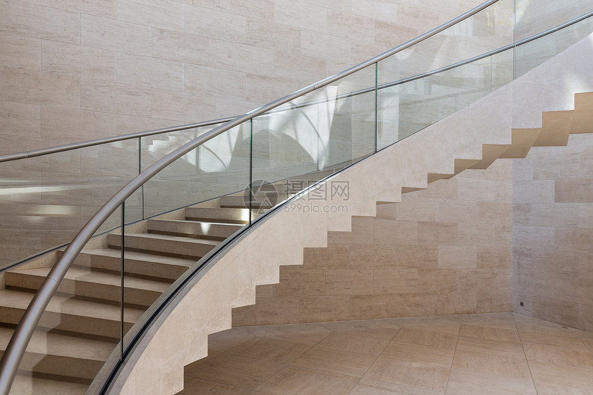 现代曲线楼梯制成大理石钢和玻璃颜色灰和棕现代曲线楼梯制成大理石钢和玻璃图片