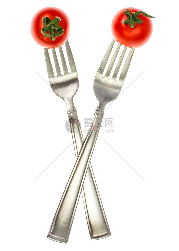 红鸡尾番茄在叉子上的图象素食品概念工作室照片图片