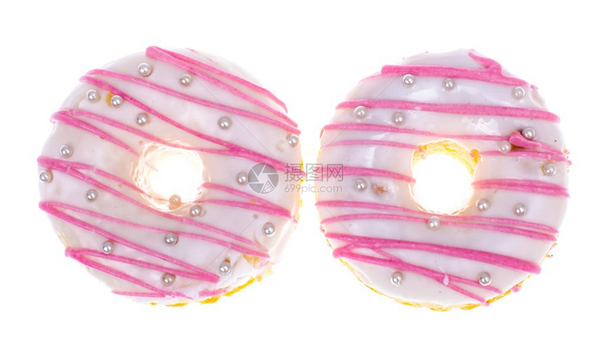 美味甜圈在光背景上加白粉色玻璃工作室照片图片