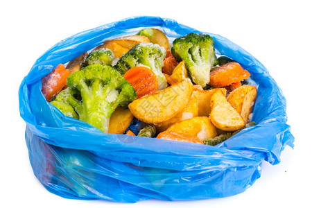 蓝色包一张蓝色袋中冻结的混合蔬菜一张工作室照片一张蓝色袋中冻结的混合蔬菜背景