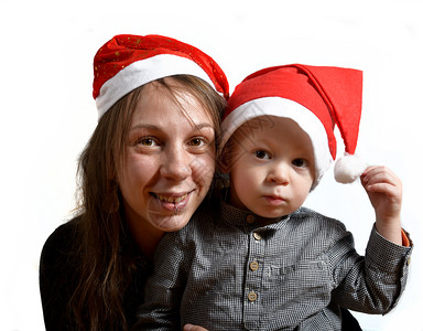 母亲和孩子的帽圣诞老人的帽子白色背景的圣诞老人图片