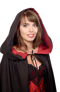 穿着黑色披风的漂亮女孩穿着黑色斗篷给白背景的万圣节女神图片
