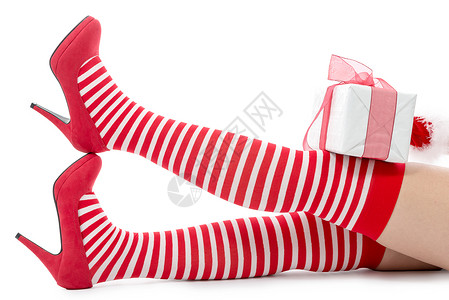 以白色背景孤立的感圣诞老人女子腿图片