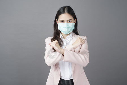 商业妇女佩戴外科面具商业保护概念图片