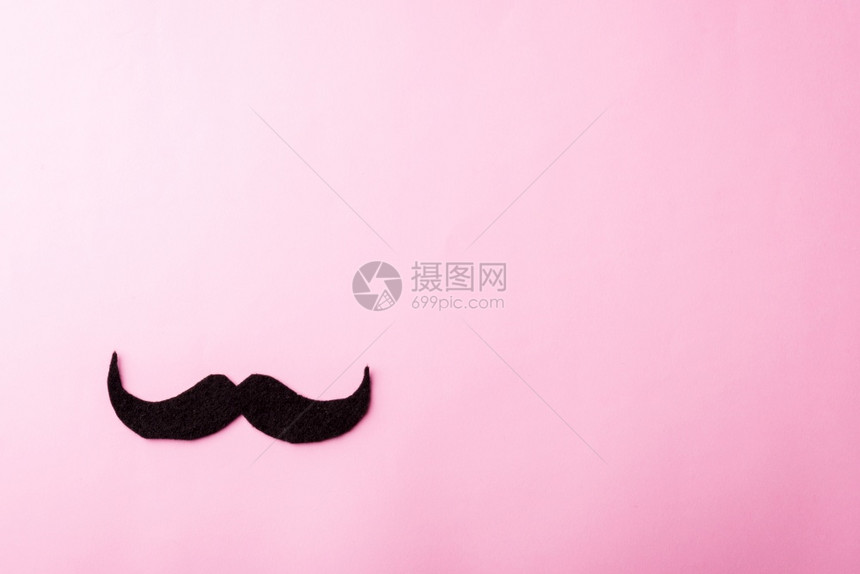 黑胡子纸粉红背景的摄影棚粉红背景的拍摄片前列腺癌意识月父亲节最低程度的1月胡子概念图片