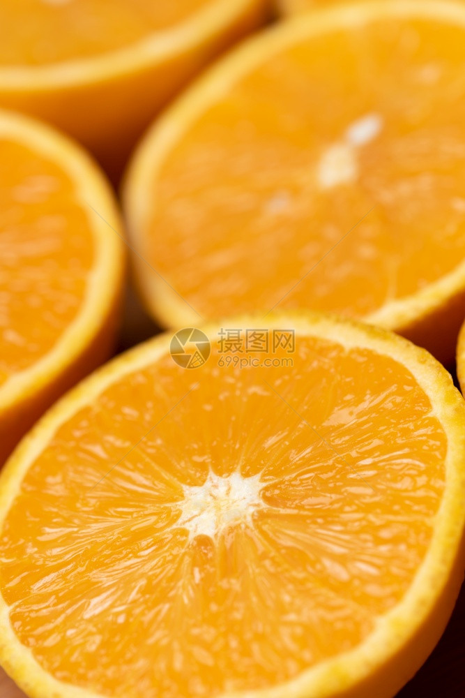 橙色背景关闭半切水果以彼此相邻的模式关闭半切水果图片