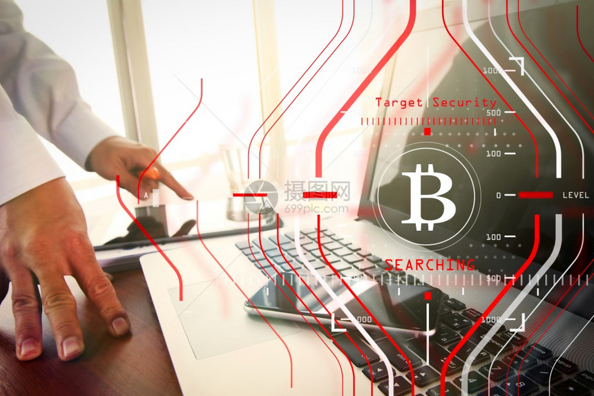 商人使用新的现代计算机和Bitcoin加密虚拟图作为概念图片