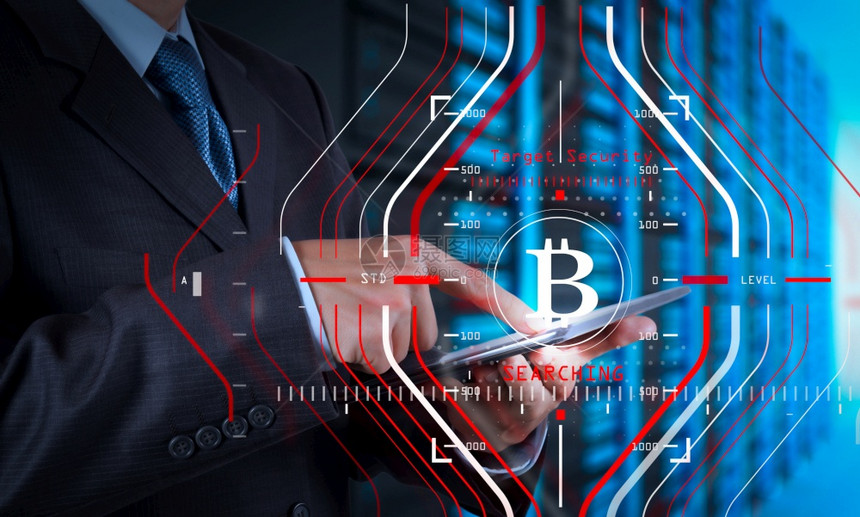 商人使用新的现代计算机和Bitcoin加密虚拟图作为概念图片