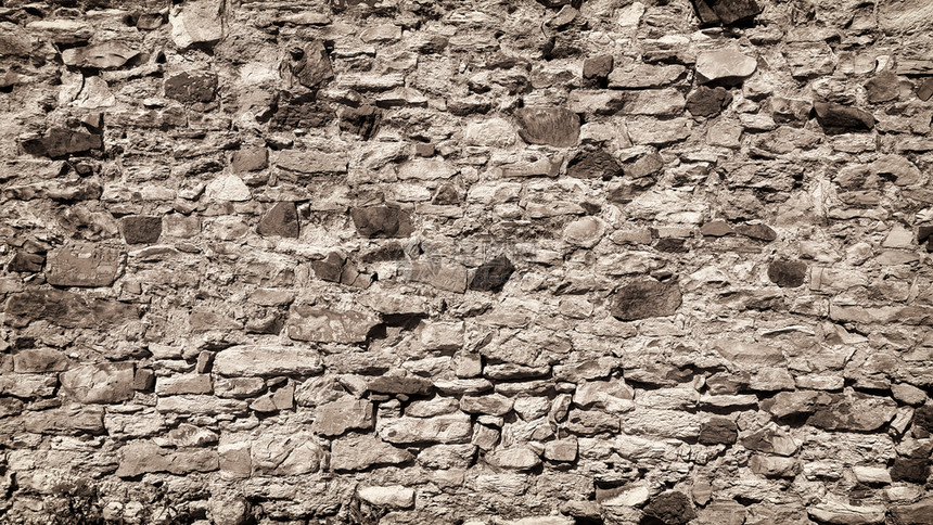 古城墙上有石头碎和砖块紧贴的刻板纹理图片