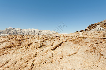 以色列内盖夫沙漠岩石丘陵的孤独和空虚中东令人窒息的地貌和质背景图片