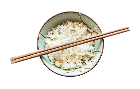 在杯子上方的筷顶部视图白背景的煮饭稻被孤立图片