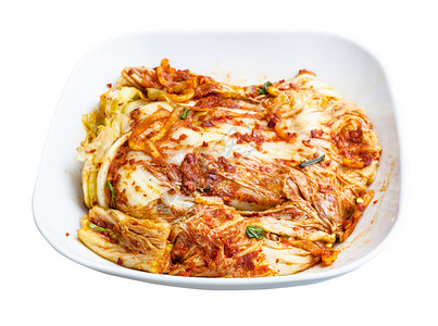班禅Korean烹饪kimchi白碗中的开胃菜spicepappa卷心菜背景