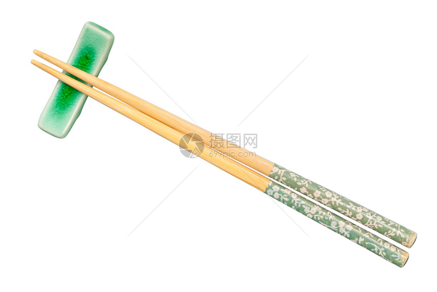 白底片隔离在筷子休息处的装饰木筷子顶部视图图片