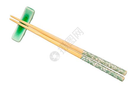 白底片隔离在筷子休息处的装饰木筷子顶部视图图片