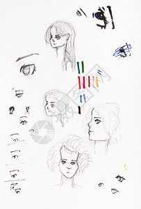 用黑铅笔手工绘制女孩头和眼睛的草图白纸上触摸笔背景图片