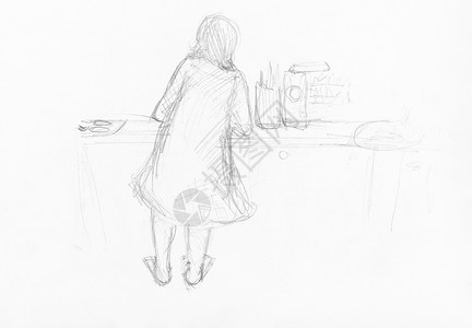 在厨房桌上用白纸的黑铅笔手工绘制的母亲烹饪食物的草图图片