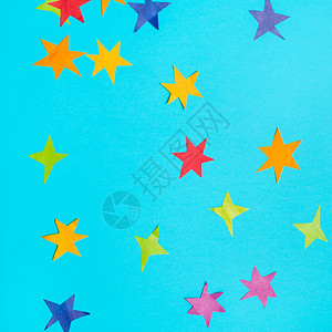 蓝绿的面纸上彩色剪切的恒星图片