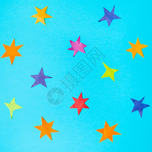 蓝绿的面纸上彩色剪切了各种恒星的拼图图片