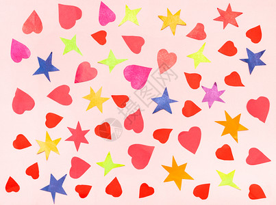 粉红面纸上的彩颜色剪切了各种恒星和红心的拼图图片
