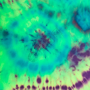 在丝织上用冷铁眼棒式丝织物技术绘制的绿色底手工涂料中的抽象污点图片